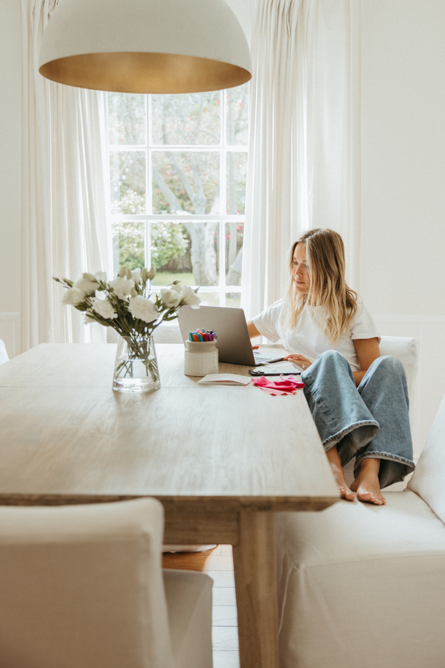 Blonde woman typing on computer_postpartum sex