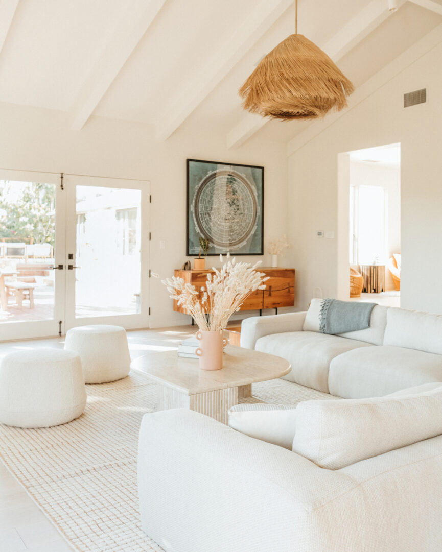 Bright white furniture in neutral living room.