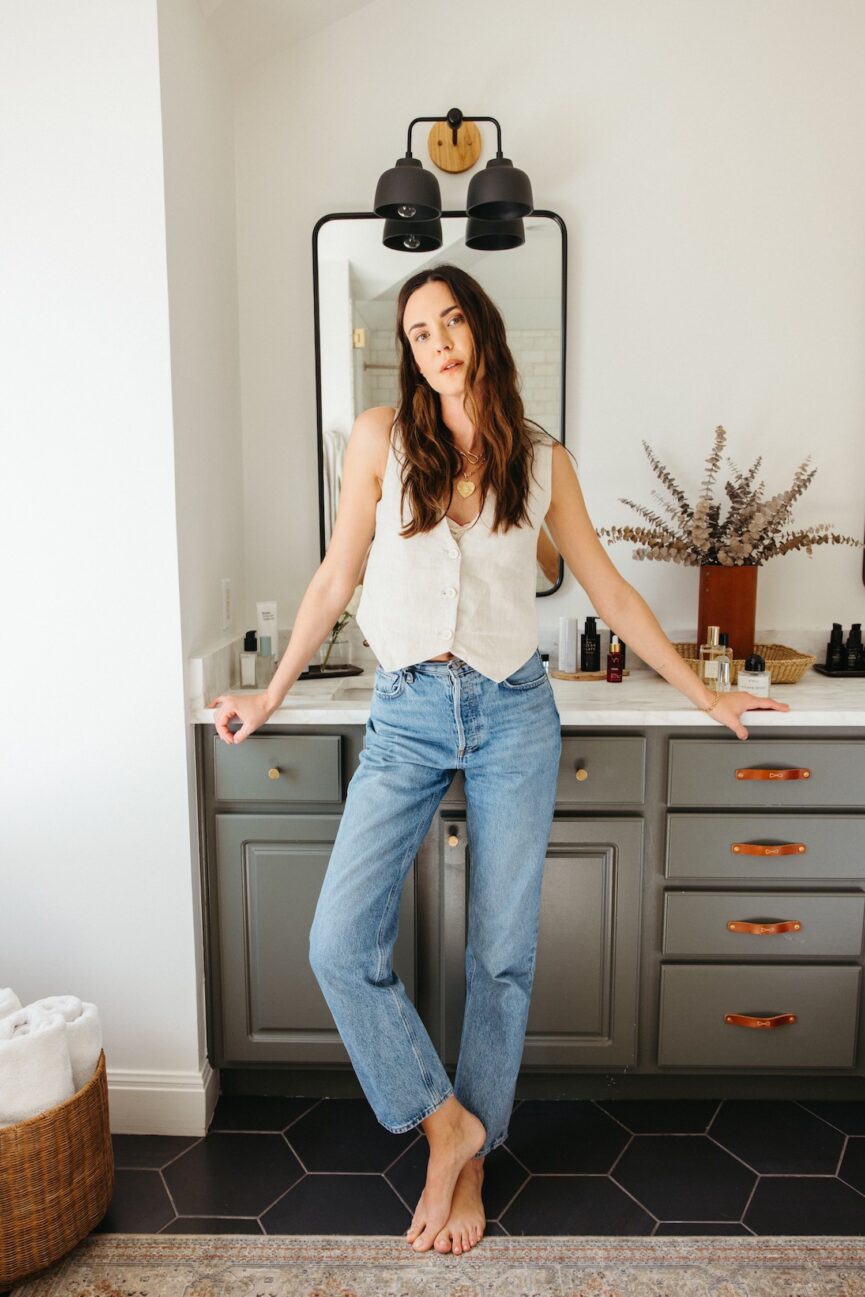 Odette Annabel standing in a bathroom.