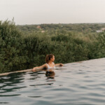 Woman outside in pool.