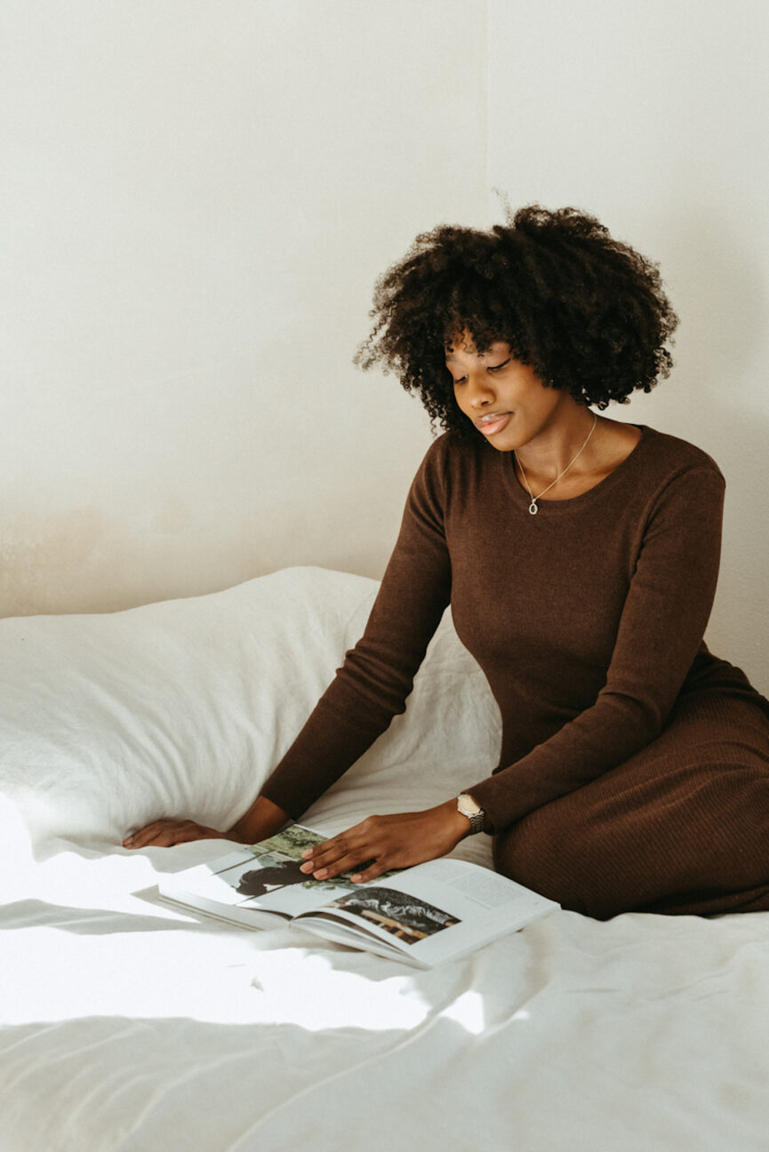 Woman reading on bed.